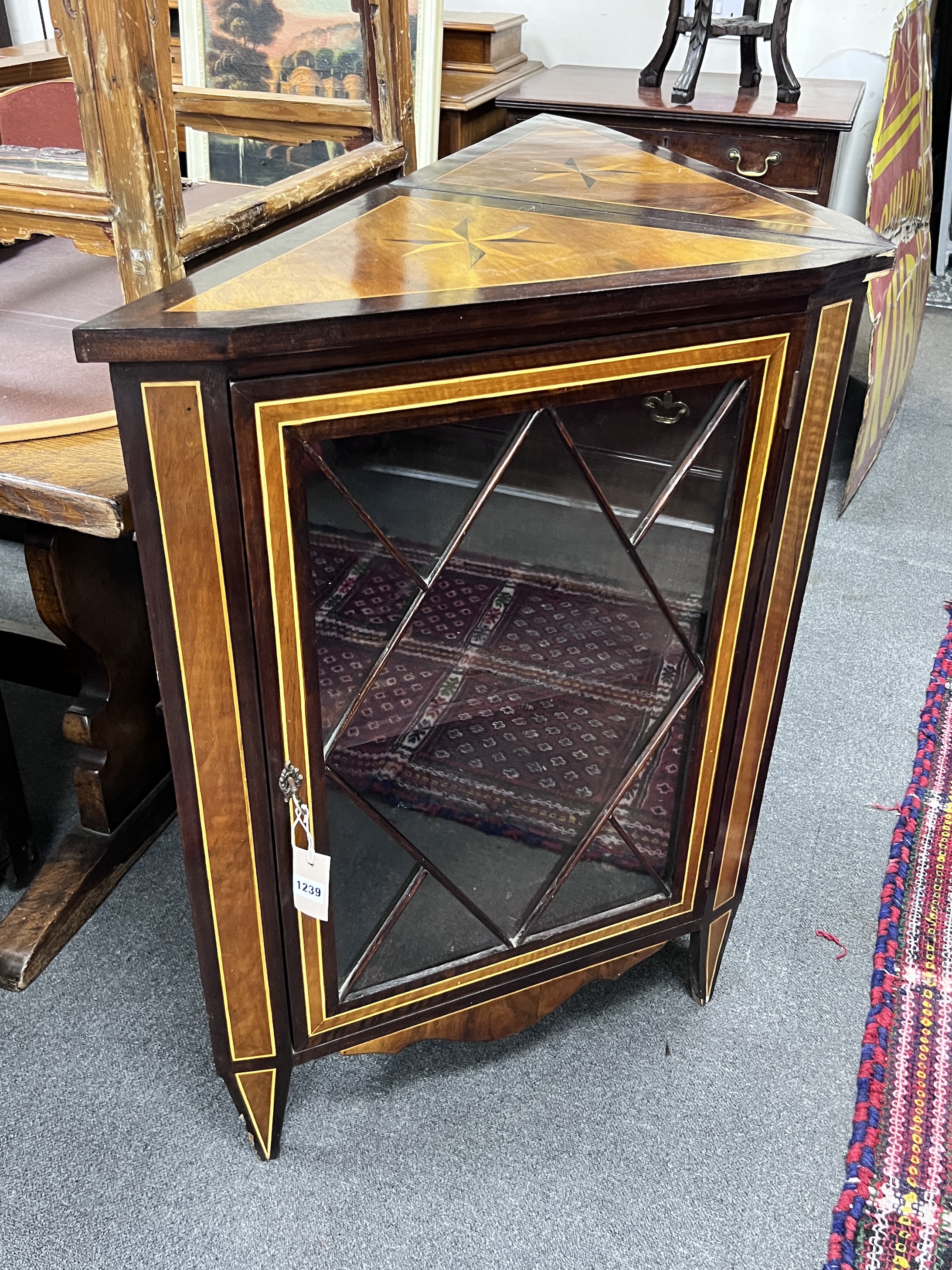 A pair of 19th century Dutch inlaid and stained beech corner cabinets, each set with a Maltese Cross to the top, width 67cm, height 92cm